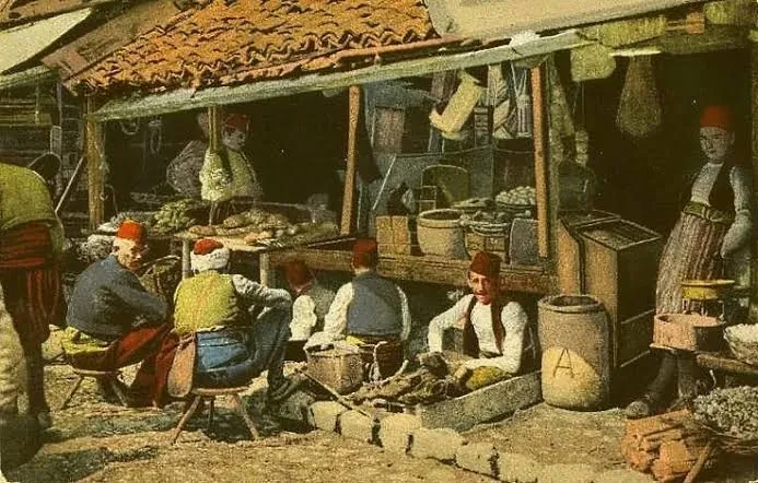 Craftsmen and traders in Sarajevo's bazaar, on an old coloured postcard.